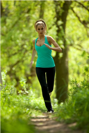 iStock- model running through forest